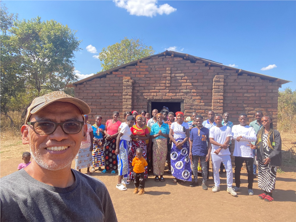 Lay missionary Freddie H. Bernardino visiting one of the outstations of the Parish at Chikowa.