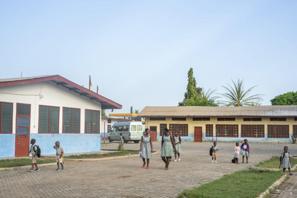 Students arriving from their homes in the morning and walking to their classrooms where their lessons will commence.