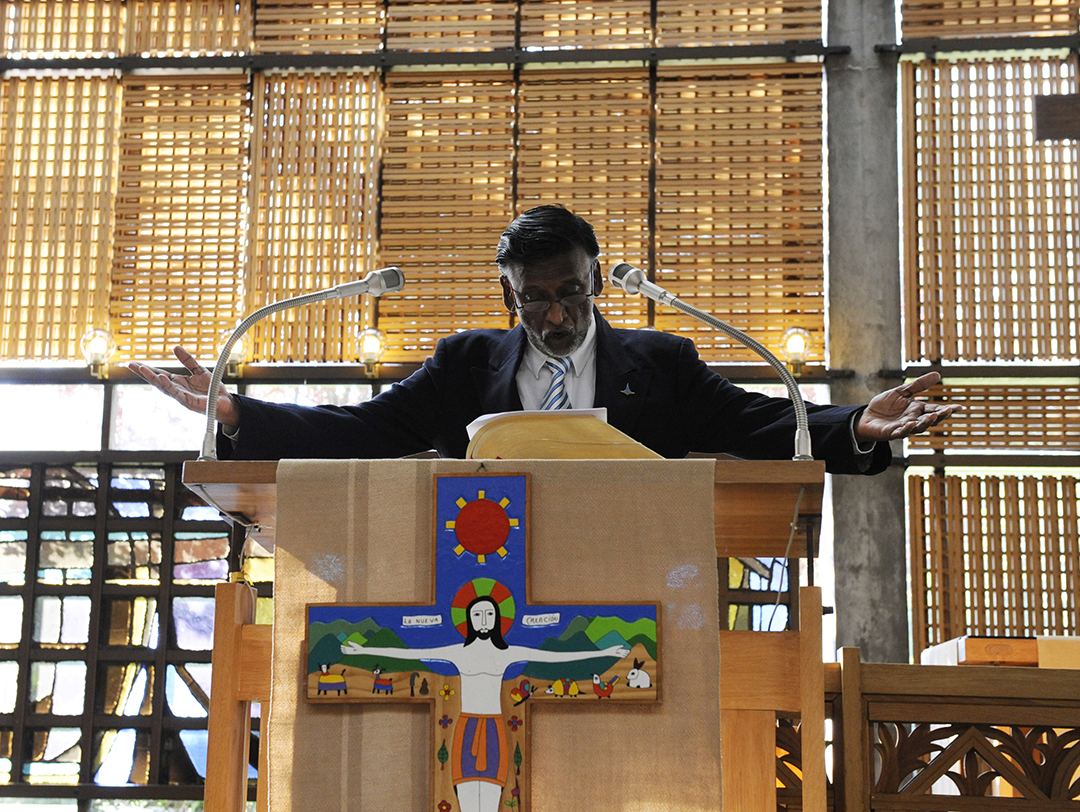 Rev. Chandran Paul Martin from the Lutheran World Federation reading a prayer during the Church of Norway’s Bishops' Conference visit to the Ecumenical Center.