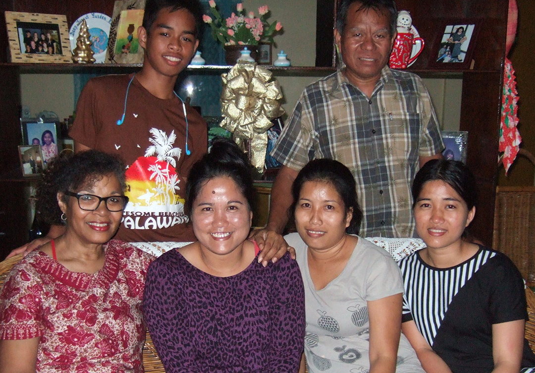 Jacqueline Huggins with three of the ten Kagayanen Bible Translators—Sisters Mayra, Melanie, and Monalisa—along with Pastor Cayaban and his son.