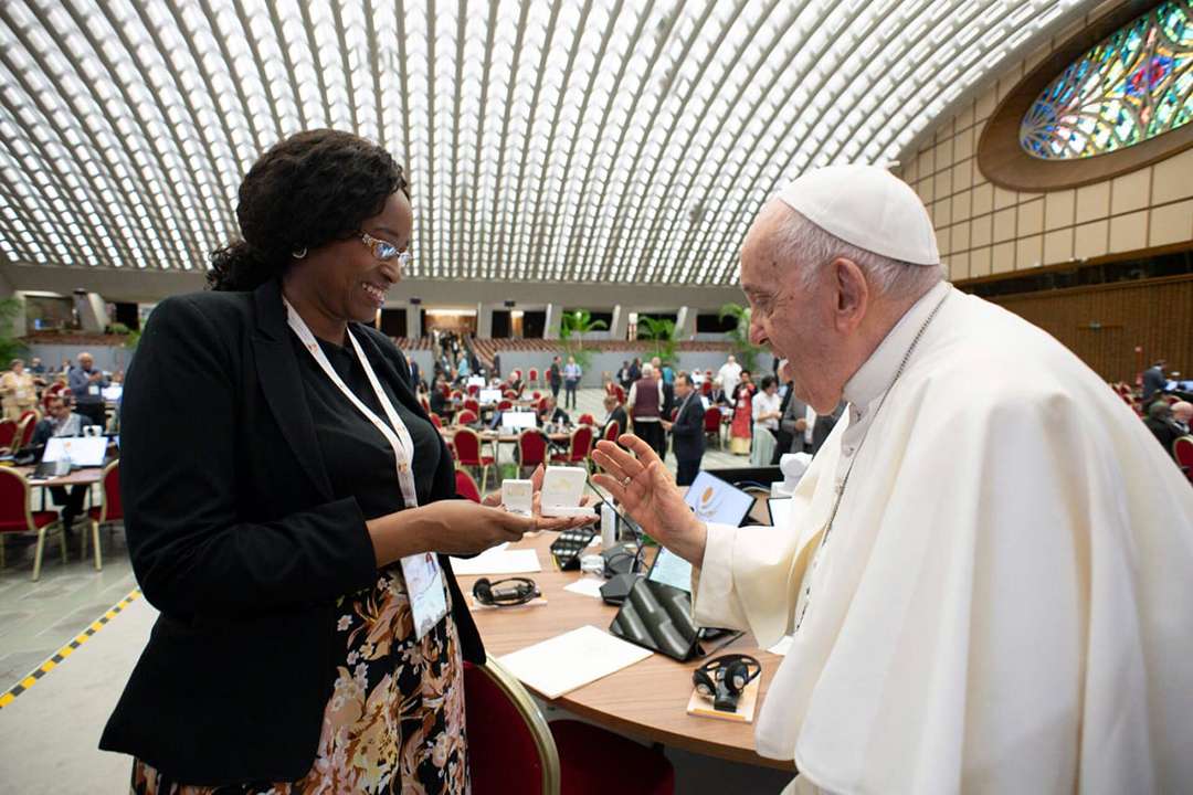 Sheila Pires receiving a blessing from Pope Francis during the Synod on Synodality.