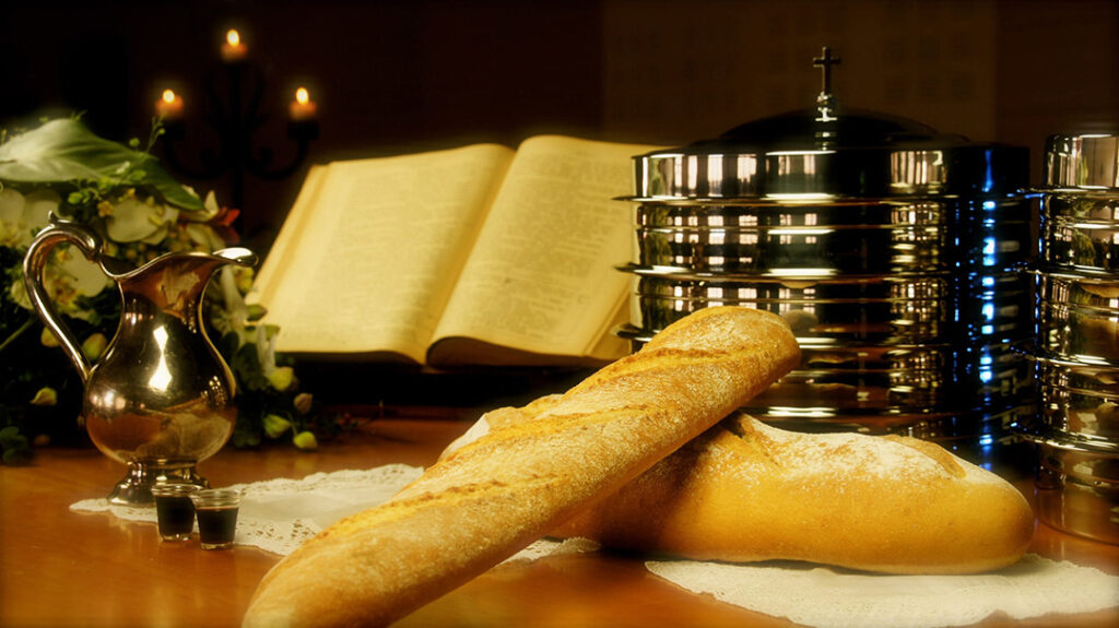 Close-up of bread and wine, traditional symbols of the Eucharist, representing the memorial of salvation.